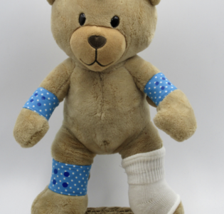 De foto van het product Pleisters + gipsbeen voor beer Kiki