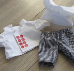 De foto van het product Bakker | Kokskleding past op handpop Bobbi